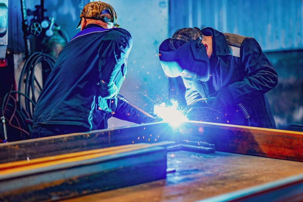 A,Welder,Wearing,A,Protective,Mask,For,Metal,Welding,And